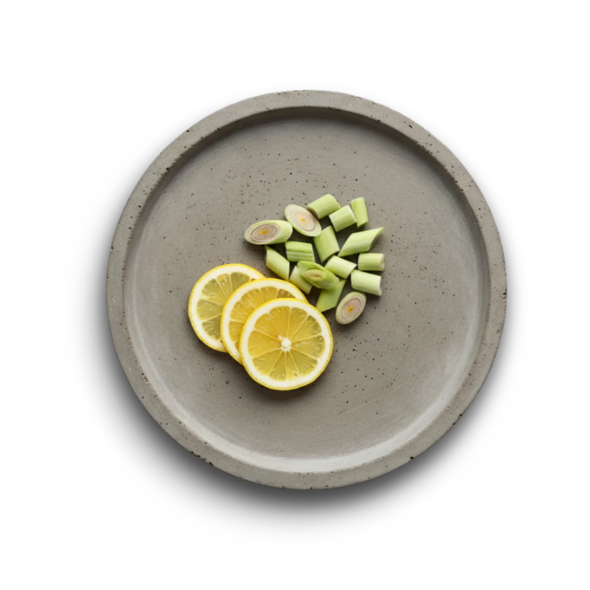 Tallow Cream Zutaten Zitronengras und Zitrone auf einem Betonteller